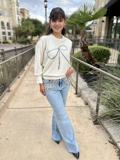 six/fifty bow sweater paired with rhinestone denim jeans at san antonio boutique store